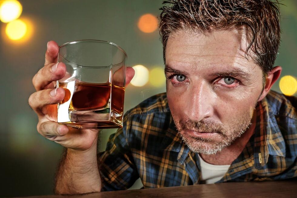 An alcoholic man looks painful